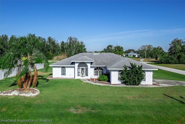 back of property featuring a yard