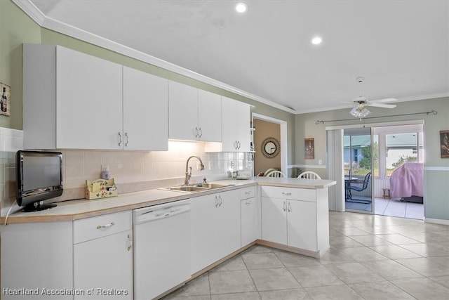 kitchen featuring sink, dishwasher, white cabinetry, ornamental molding, and kitchen peninsula