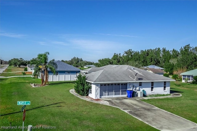 back of house with a yard and a garage