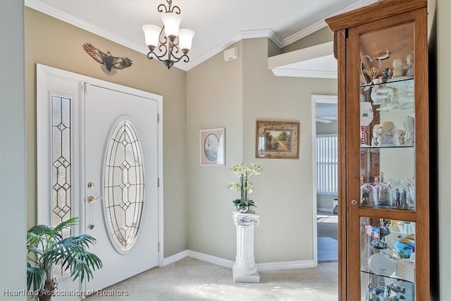 entryway with crown molding, a chandelier, and light tile patterned flooring