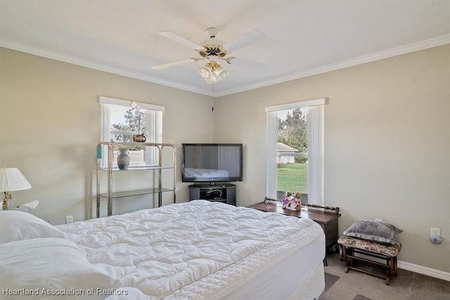 bedroom with crown molding, carpet flooring, and ceiling fan