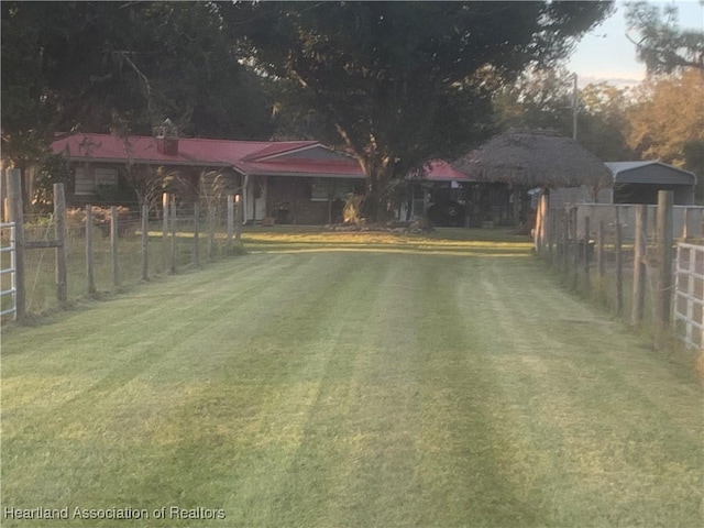 view of yard at dusk