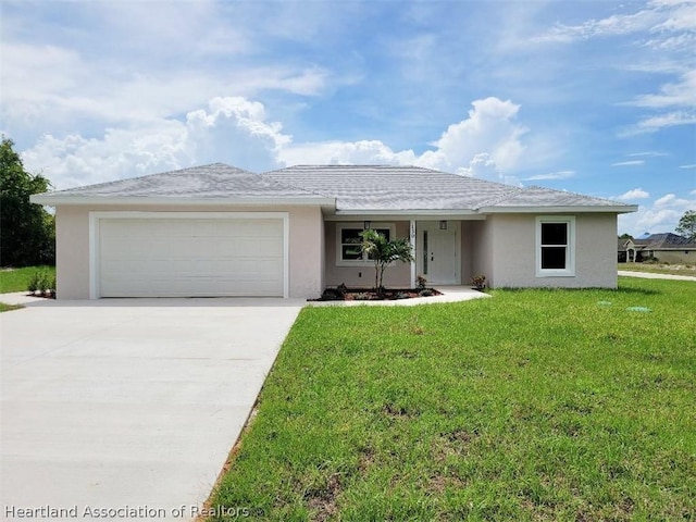 ranch-style home featuring a garage and a front lawn