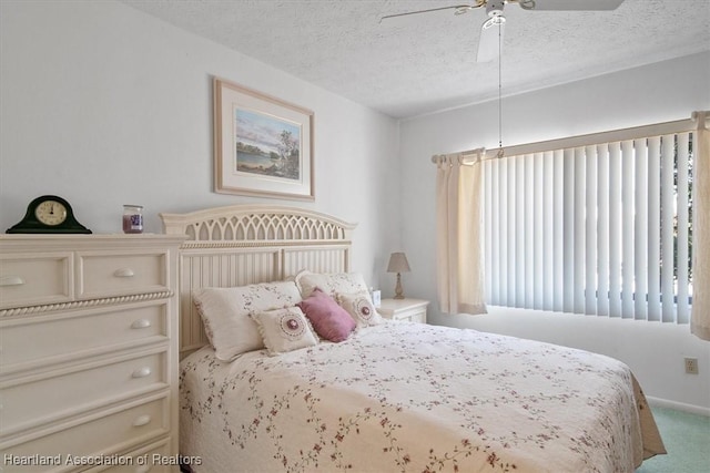 4989 Casablanca Cir Unit J-3, Sebring, FL 33870 - bedroom featuring ceiling fan, carpet floors, and a textured ceiling