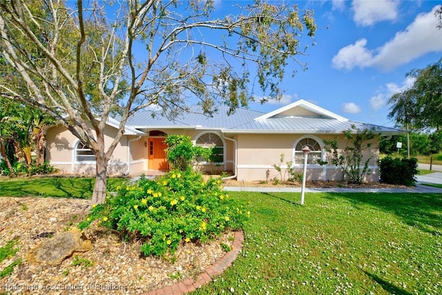 single story home featuring a front yard