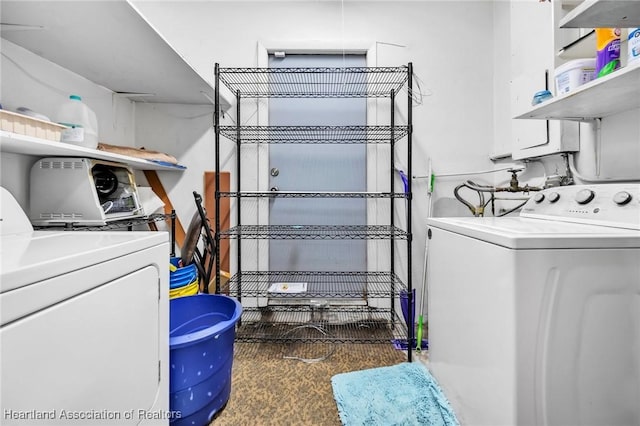 laundry room featuring laundry area and washer and clothes dryer