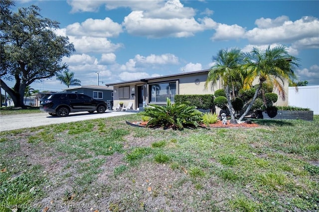 view of front of house with driveway and stucco siding