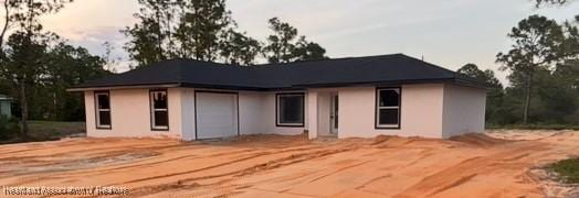 509 Concert Dr, Lake Placid, FL 33852 - rear view of property with stucco siding