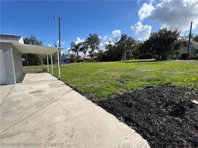 view of yard with a carport