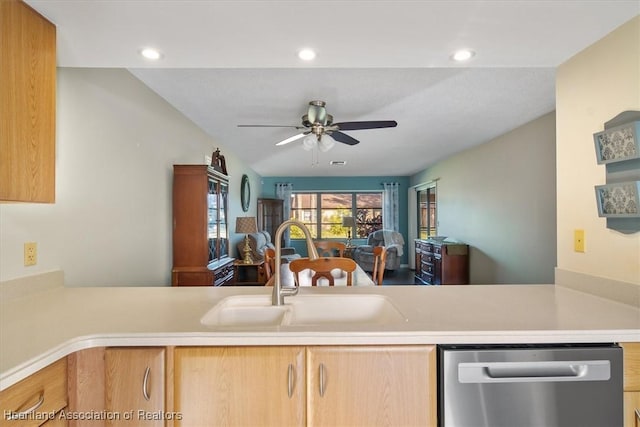 kitchen with a sink, open floor plan, light countertops, dishwasher, and ceiling fan