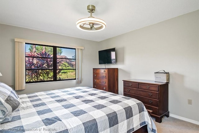 carpeted bedroom with baseboards