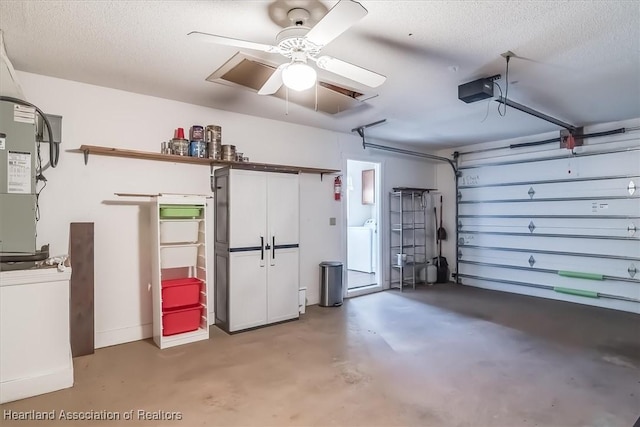 garage featuring a ceiling fan, washer / dryer, and a garage door opener