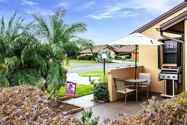 view of patio with a grill