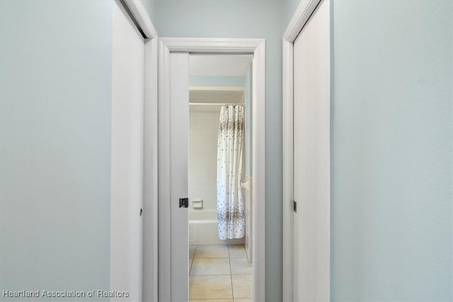 hall with light tile patterned flooring