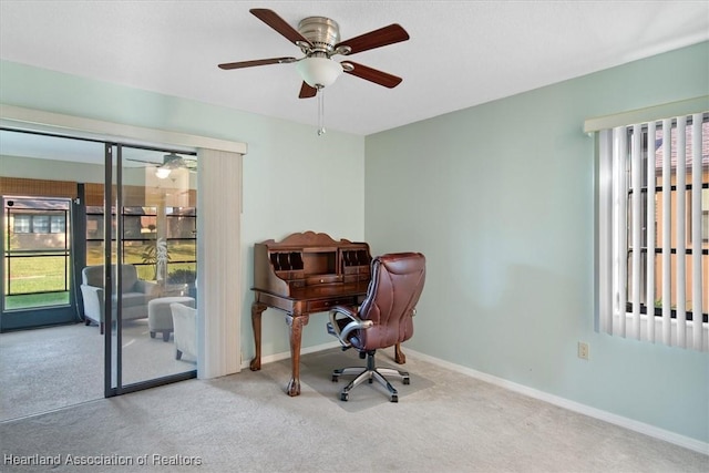 office with carpet, baseboards, and ceiling fan