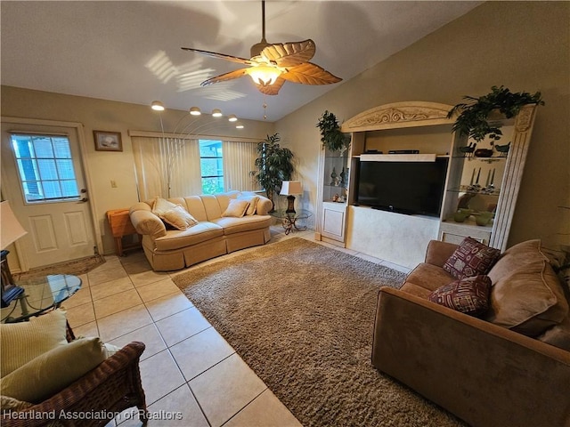 tiled living room with ceiling fan