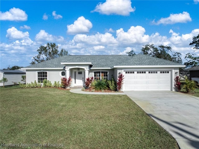 single story home with a garage and a front lawn