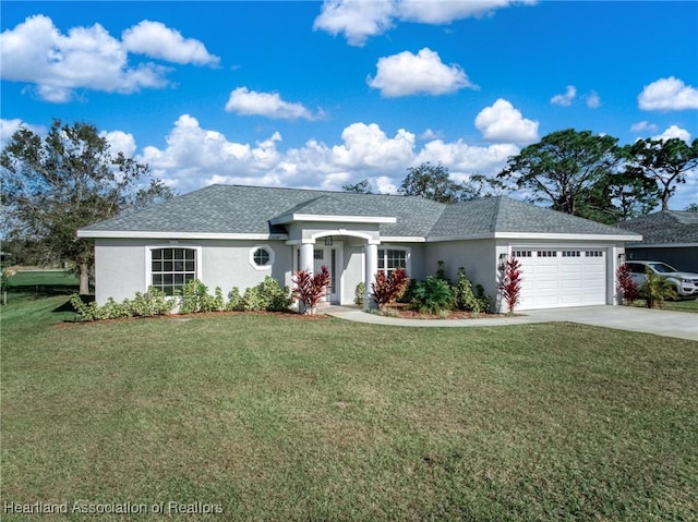 ranch-style home with a garage and a front lawn