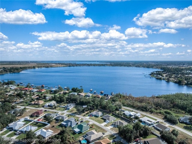 birds eye view of property featuring a water view