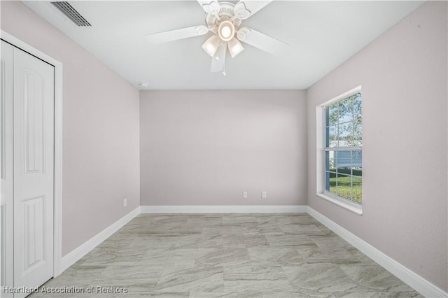 unfurnished room featuring ceiling fan