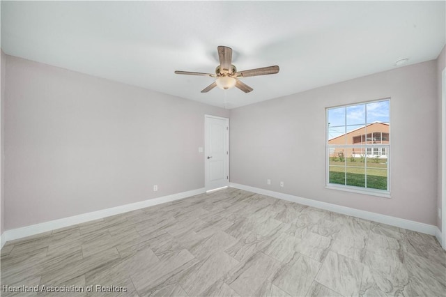 unfurnished room with ceiling fan