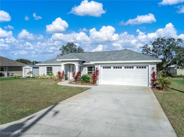 ranch-style home with a garage and a front lawn