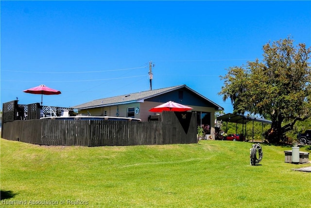 1503 Goldbud St, Lake Placid, FL 33852 - rear view of house with fence and a yard