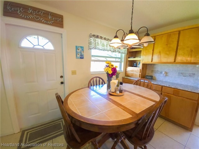 1503 Goldbud St, Lake Placid, FL 33852 - dining area featuring a notable chandelier and light tile patterned floors