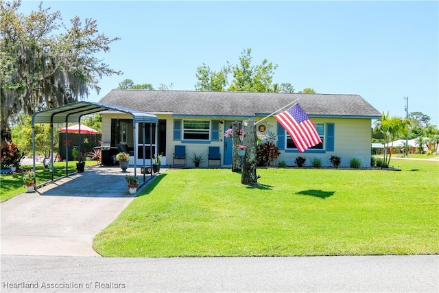 1503 Goldbud St, Lake Placid, FL 33852 - ranch-style home with driveway, a detached carport, and a front yard