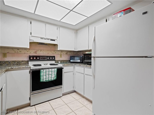 kitchen with white cabinetry, white appliances, and light tile patterned floors