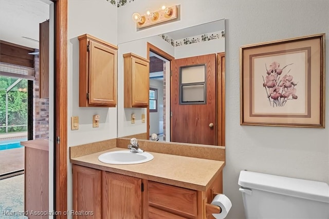 bathroom with vanity and toilet