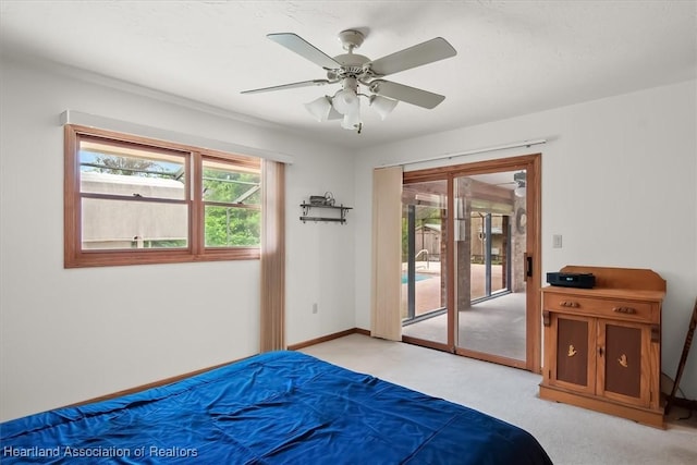 bedroom with access to exterior, ceiling fan, and light carpet