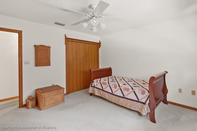 carpeted bedroom with ceiling fan