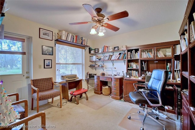 office area featuring ceiling fan and carpet