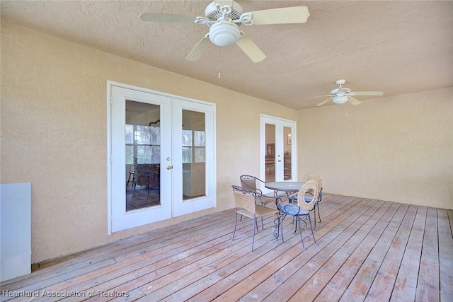 wooden terrace with french doors and ceiling fan