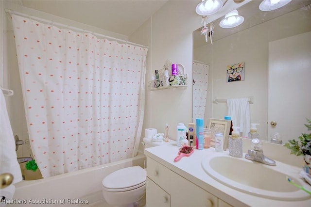 bathroom with shower / bath combo, vanity, and toilet