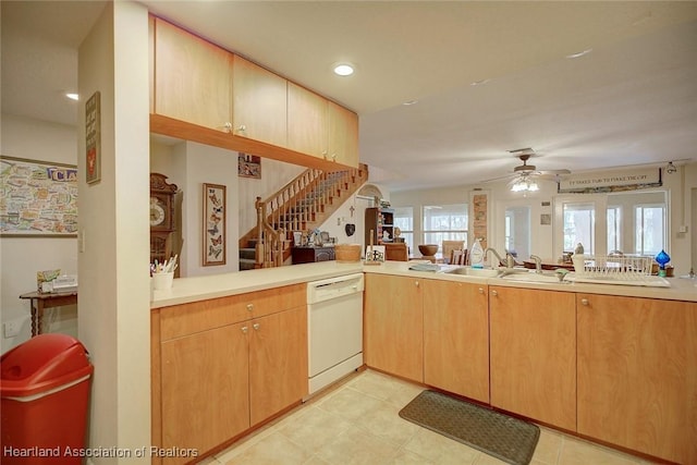 kitchen with white dishwasher, recessed lighting, a sink, a ceiling fan, and light countertops