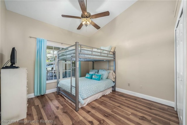 560 Lake June Rd, Lake Placid, FL 33852 - unfurnished bedroom featuring baseboards, wood finished floors, and ceiling fan