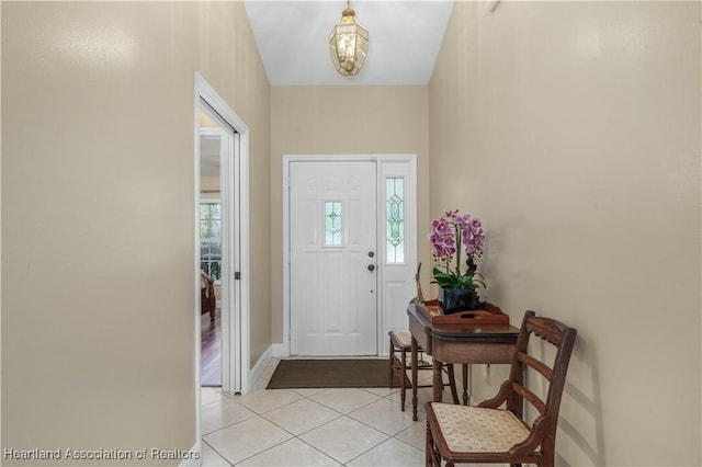 560 Lake June Rd, Lake Placid, FL 33852 - foyer featuring a wealth of natural light, a chandelier, and light tile patterned floors