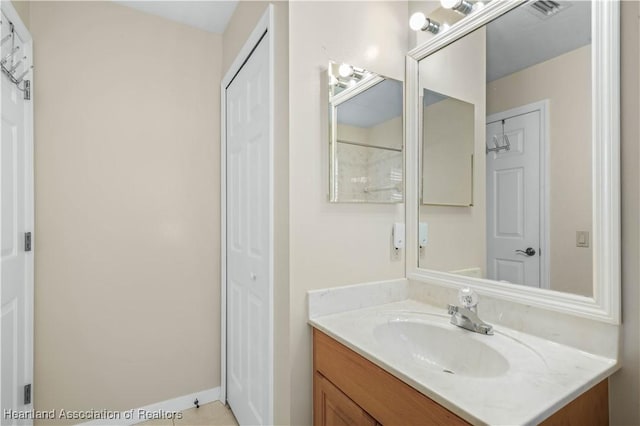 560 Lake June Rd, Lake Placid, FL 33852 - bathroom with baseboards, visible vents, and vanity