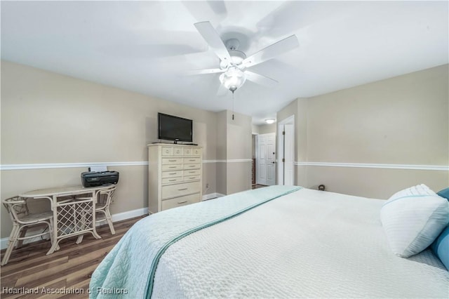 560 Lake June Rd, Lake Placid, FL 33852 - bedroom with baseboards, wood finished floors, and a ceiling fan