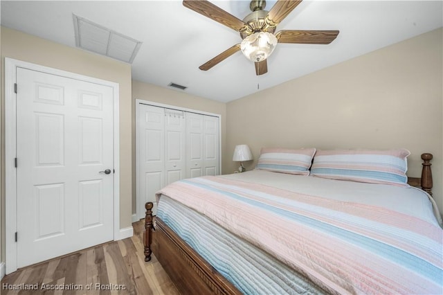 560 Lake June Rd, Lake Placid, FL 33852 - bedroom with a closet, ceiling fan, visible vents, and wood finished floors