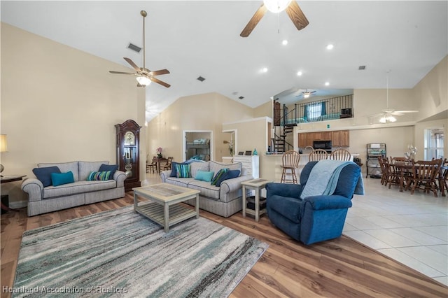 560 Lake June Rd, Lake Placid, FL 33852 - living area featuring stairs, high vaulted ceiling, and ceiling fan