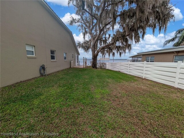 560 Lake June Rd, Lake Placid, FL 33852 - view of yard with a fenced backyard