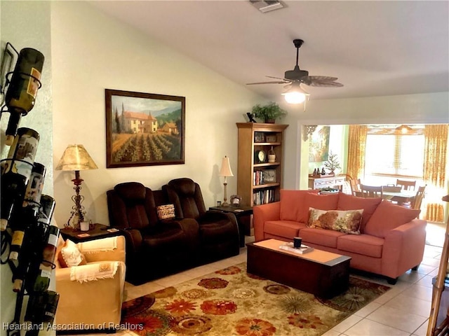 tiled living room featuring lofted ceiling and ceiling fan