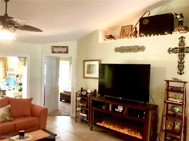 tiled living room featuring ceiling fan