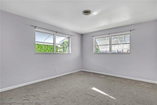 115 Elwa Pl, West Palm Beach, FL 33405 - carpeted spare room featuring baseboards