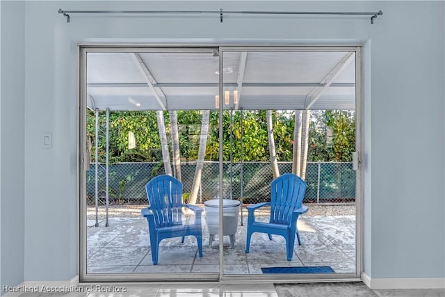 115 Elwa Pl, West Palm Beach, FL 33405 - doorway to outside with baseboards