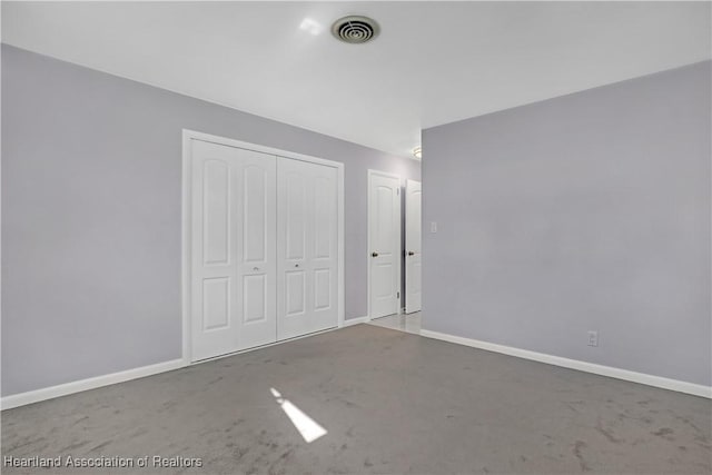 115 Elwa Pl, West Palm Beach, FL 33405 - unfurnished bedroom with a closet and carpet