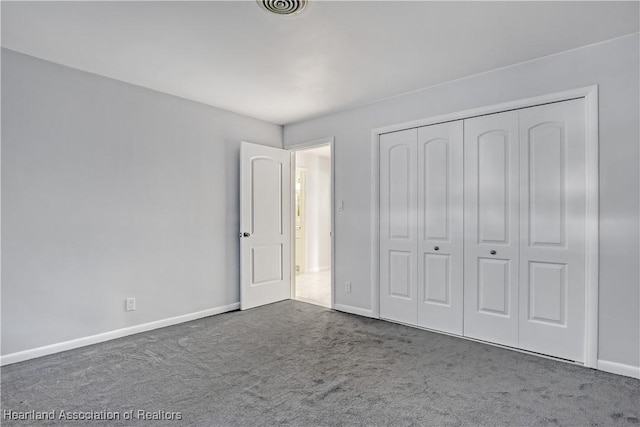 115 Elwa Pl, West Palm Beach, FL 33405 - unfurnished bedroom featuring carpet and a closet